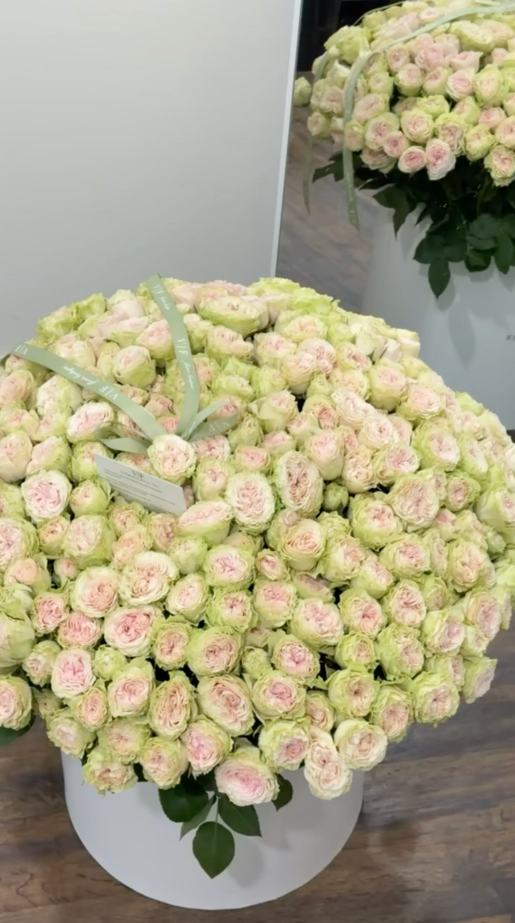 XL white box filled with soft green spray roses and blush-pink centers for a birthday arrangement