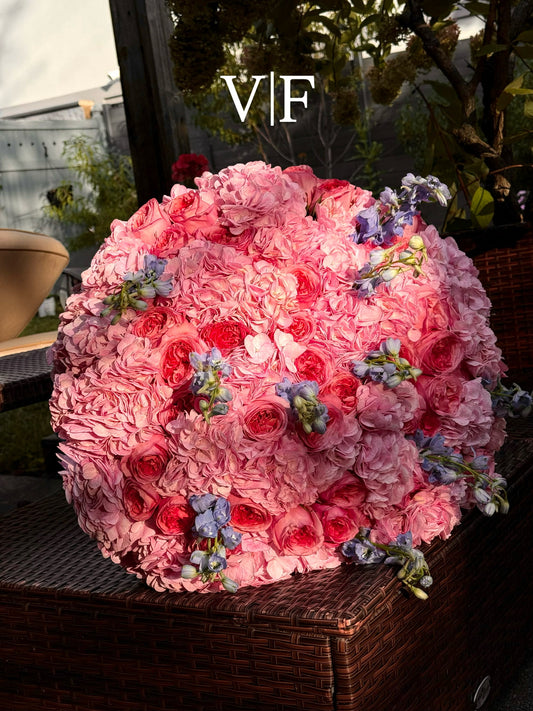 Pink hydrangeas and blue delphinium bouquet with roses
