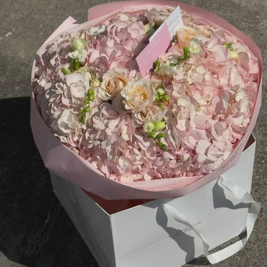 Blush hydrangeas with soft spray roses in a birthday bouquet, ready for delivery across Miami-Dade and Broward County