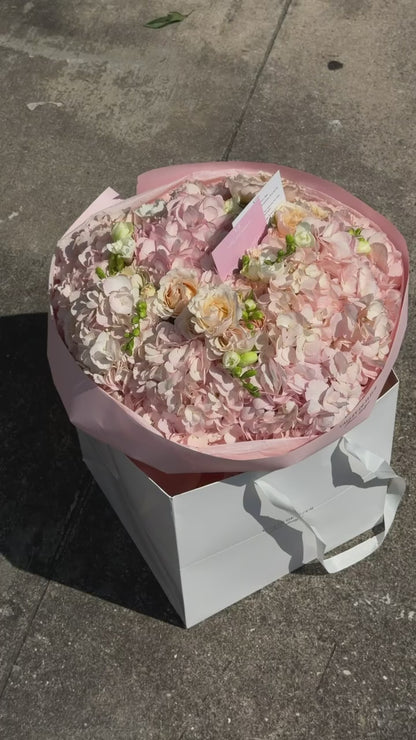 Blush hydrangeas with soft spray roses in a birthday bouquet, ready for delivery across Miami-Dade and Broward County