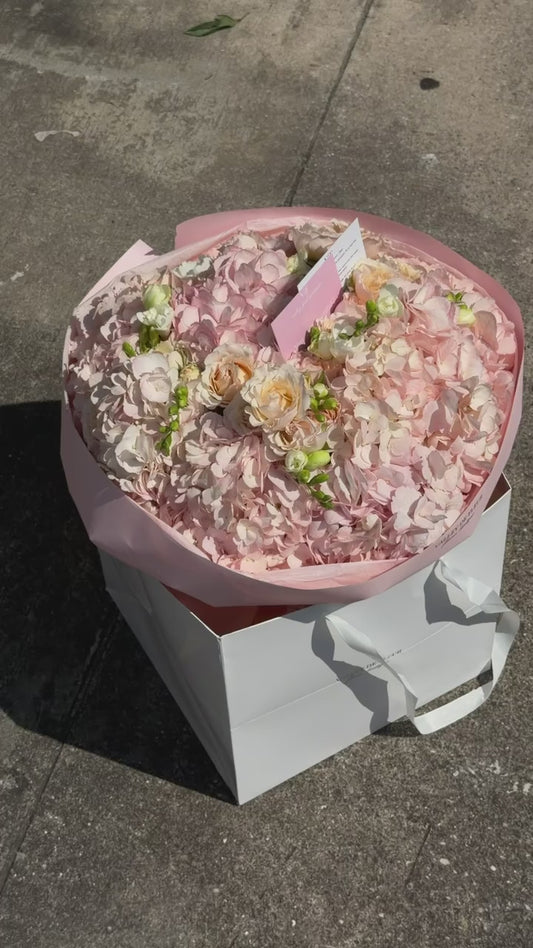 Blush hydrangeas with soft spray roses in a birthday bouquet, ready for delivery across Miami-Dade and Broward County