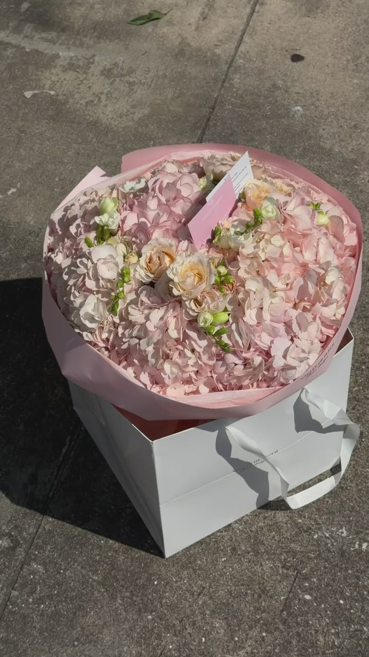 Blush hydrangeas with soft spray roses in a birthday bouquet, ready for delivery across Miami-Dade and Broward County