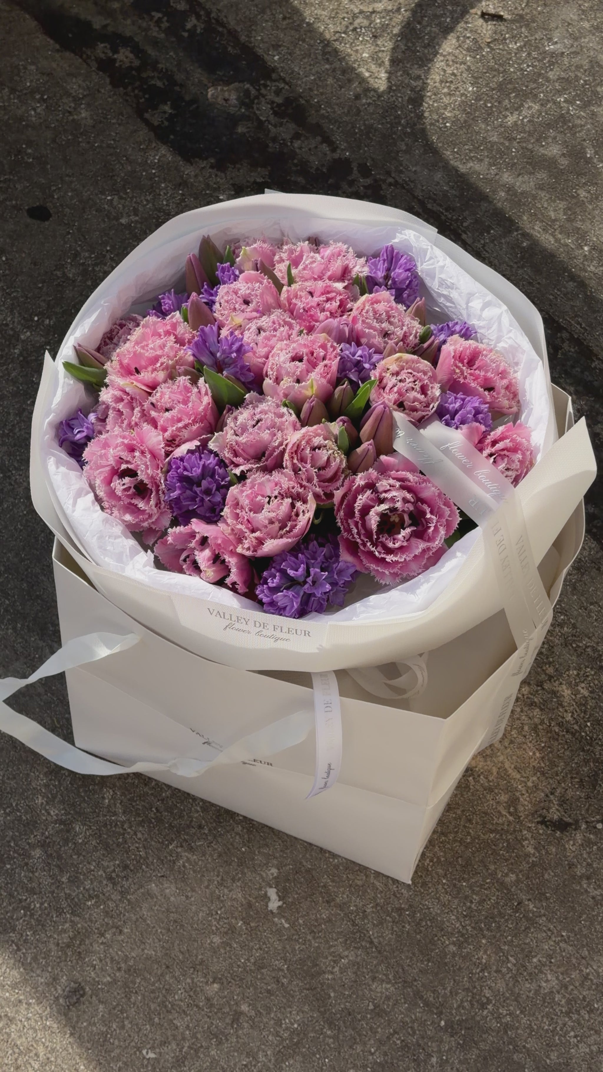 Romantic light pink tulips arranged in a luxury anniversary flower bouquet