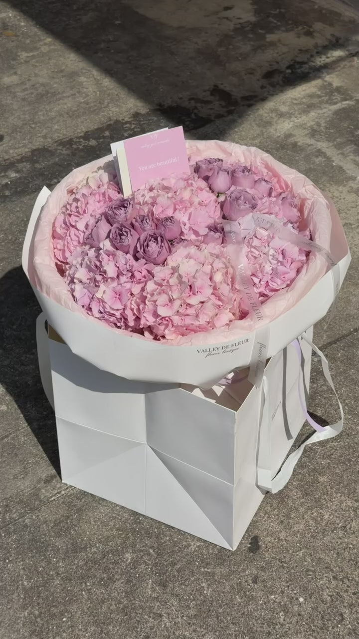 Light pink hydrangeas and lavender spray roses birthday bouquet ready for delivery across Miami-Dade and Broward County