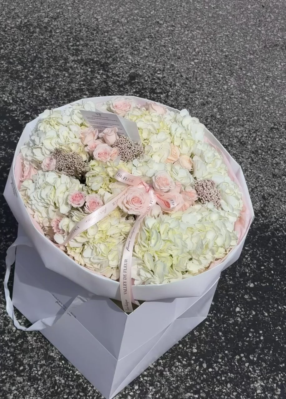 White hydrangeas and light pink Majolica roses birthday bouquet ready for flower delivery across Miami-Dade and Broward County