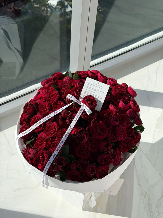 Birthday bouquet filled with deep red Piano spray roses