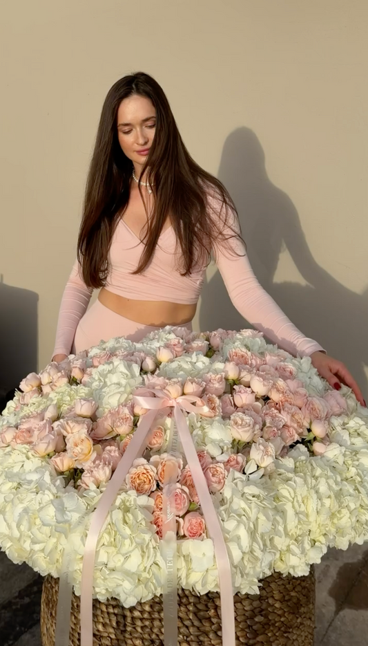 XXL birthday flower basket with white hydrangeas, blush spray roses and pink ribbon